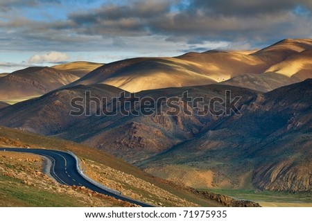 The road in Tibet plateau at sunset.