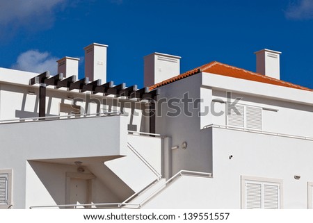New White Resort Apartment House in Portugal against bright blue sky. Horizontal shot