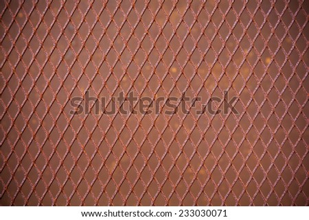 heavy duty rusty metal background with non slip repetitive patten. Concept image for urbanization, steampunk, construction, safety at work, oxidation.