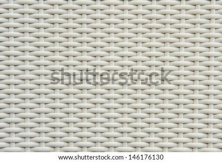 A chair white white basket weave pattern