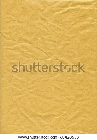 An isolated old grunge yellow paper folded