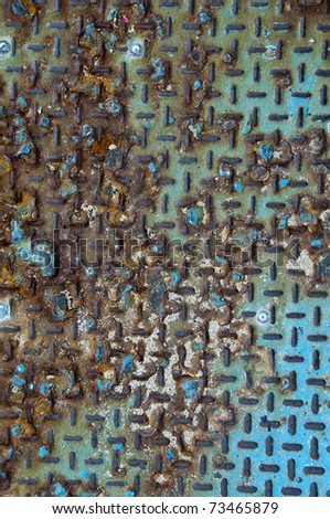 Background of old metal diamond plate in brown blue color