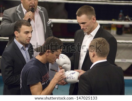 MOSCOW - SEPTEMBER 21: V. Makarov gives autograph just before Osminog International clubs tournament  on September 21, 2012. Moscow, Russia