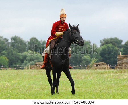 RUSSIA, MOLODI VILLAGE - JULY 27: Unidentified knight ride on event dedicated to Victory in battle near the Molodi village 1572, on July 27, 2013, in Moscow region, Russia