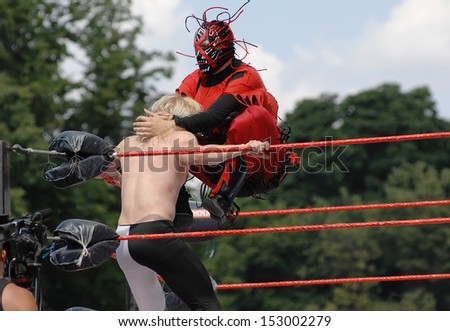 RUSSIA, MOSCOW-JULY 13: Unidentified wrestlers Professional wrestling are fighting in the ring in the sports festival Moscow City Games 2013 in Moscow, Arena Luzhniki; on July 13, 2013