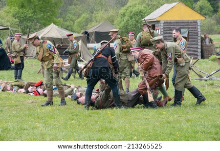 RUSSIA, CHERNOGOLOVKA - MAY 17: Unidentified soldier move a dead soldier on History reenactment of battle of Civil War in 1914-1919 on May 17, 2014, Russia