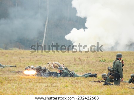 RUSSIA, BORODINO - OCTOBER 12: Unidentified armed german soldiers lay down on the field on reenactment of the battle in WWII near the Borodino in 1941, Borodino, on 12 October, 2014, Russia