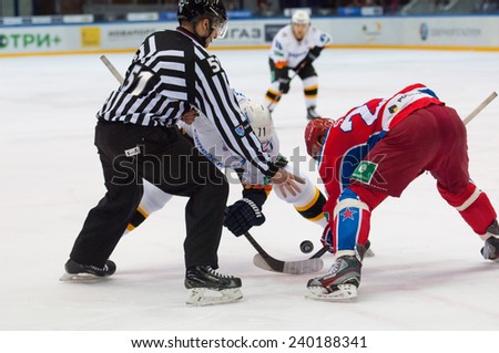MOSCOW - DECEMBER 3: Stolyarov G. (71) vs Stas A. (23) on face-off on game CSKA vs Severstal on Russian KHL premier hockey league Championship on December 3, 2014, in Moscow, Russia. CSKA won 9:1