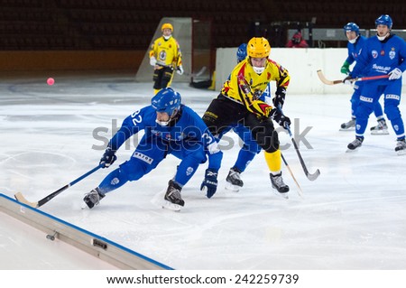MOSCOW - DECEMBER 12, 2014: Pavel Bulatov (32) in action during the Russian  bandy league game Dynamo Moscow vs SKA Neftyanik in sport palace Krilatskoe, Moscow, Russia. Dynamo won 9:1
