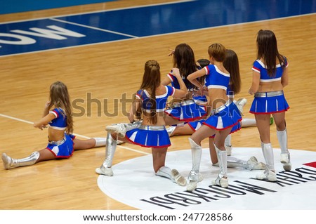 MOSCOW - DECEMBER 4, 2014: Unidentified cheerleaders dance on the timeout on the International Europe bascketball league game Dynamo Moscow vs Maccabi Ashdod in sport palace Krilatskoe, Moscow, Russia