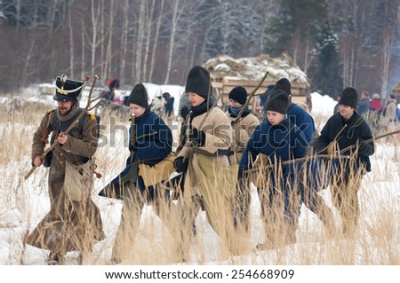RUSSIA, APRELEVKA - FEBRUARY 7: Unidentified civilians armed with cudgel walk on reenactment of the Napoleonic maneuvers near the Aprelevka city, in 1812. Moscow region, 7 February, 2015, Russia