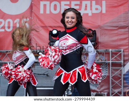 RUSSIA, MOSCOW - APRIL 18: Unidentified Cheerleaders of Spartak team dancing during on event of 80th anniversary of Spartak team in Luzhniki, Moscow, Russia, 2015