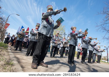 RUSSIA, ROSTOV CITY - MAY 9: Unidentified orchestra musicians walk on Victory day parade dedicated 70 anniversary of WWII end on May 9, 2015, in Yaroslavl region, Rostov the Great city, Russia