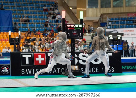 MOSCOW, RUSSIA - MAY 31 2015: Jiyeon Kim and Manon Brunet fight on the World  fencing Grand Prix Moscow Saber in Luzhniki sport palace