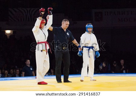 RUSSIA, MOSCOW - APRIL 18 2015: Inna Zhdanova (Red), winner, champion, and Olga Komarova (Blue) fight on World Hand to hand combat Championship in Moscow, Russia, 2015