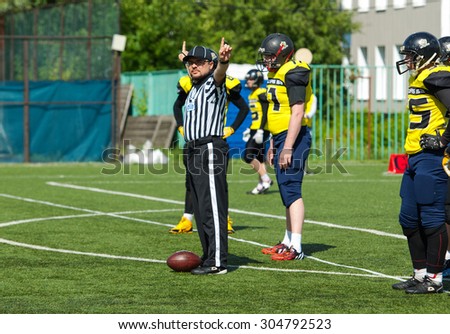 RUSSIA, TROITSK CITY - JULY 11: A referee gestures on Russian american football Championship game Spartans vs Raiders 52 on July 11, 2015, in Moscow region, Troitsk city, Russia