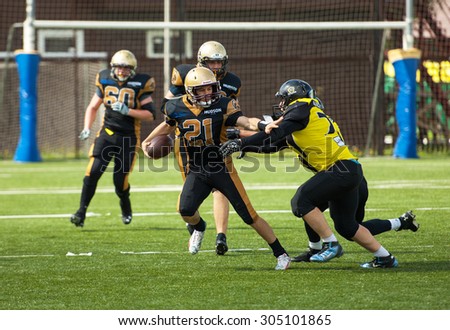 RUSSIA, TROITSK CITY - JULY 11: Ivan Goloveshkin (21) in action on Russian american football Championship game Spartans vs Raiders 52 on July 11, 2015, in Moscow region, Troitsk city, Russia