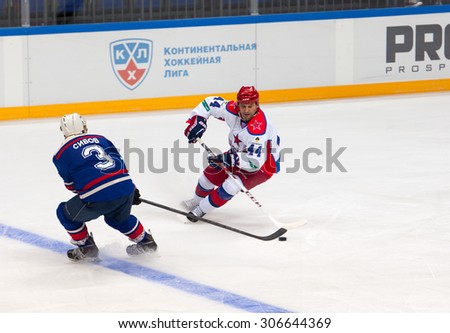 RUSSIA, MOSCOW - APRIL 27, 2015: V. Tsyplakov (44) versus A. Sivov (3) on hockey game CSKA vs SKA teams on Hockey Cup of Legends in Ice Palace VTB, Moscow, Russia