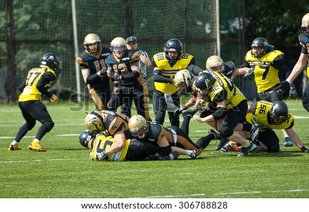 RUSSIA, TROITSK CITY - JULY 11: A. Lemeshev (15) fall down on Russian american football Championship game Spartans vs Raiders 52 on July 11, 2015, in Moscow region, Troitsk city, Russia