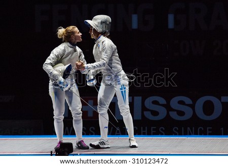 MOSCOW, RUSSIA - MAY 31 2015: O. Kharlan (L) and V. Vougiouka (R) hugging on the World  fencing Grand Prix Moscow Saber in Luzhniki sport palace
