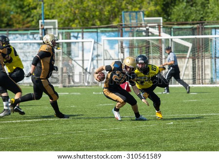 RUSSIA, TROITSK CITY - JULY 11: I. Goloveshkin (21) vs A. Danilenkov (87) in action on Russian american football Championship game Spartans vs Raiders 52 on July 11, 2015, Troitsk city, Russia