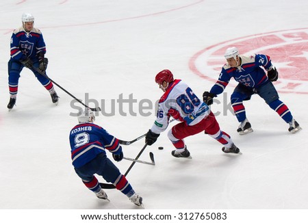 RUSSIA, MOSCOW - APRIL 27, 2015: M. Petrov (86) attack on hockey game CSKA vs SKA teams on Hockey Cup of Legends in Ice Palace VTB, Moscow, Russia