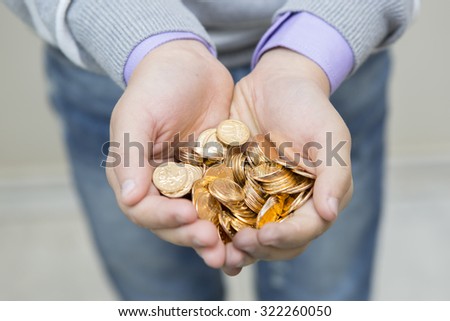 Handful of coins in palm hands