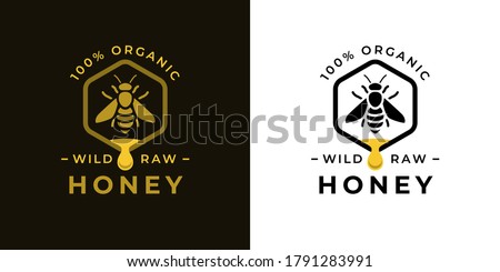 100% Natural wild raw organic honey logo label concept with bee symbol inside hexagon honeycomb nectar drop sign. Beekeeper farm badge brand identity template. Vector illustration. 