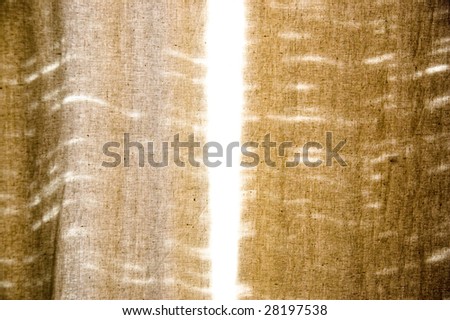 Images of sunlight passing through the thick curtains in the room