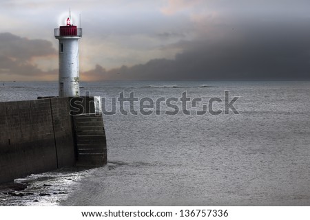 Lighthouse at the end of the mole, France, atlantic ocean