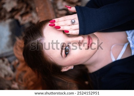 Similar – Image, Stock Photo Portrait of girl with her trendy sweater over her head having fun. Woman with tied hair, cold, hiding under her pink sweater. Fashion photo.