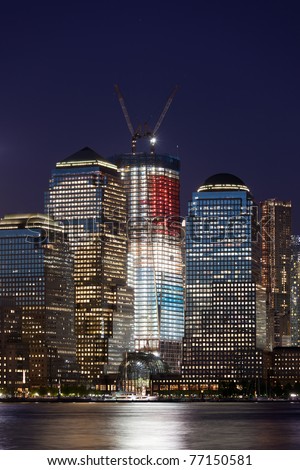 may 5, 2011. Manhattan, lower New York financial offices(downtown)  from Jersey city. One World Trade Center building under construction and color lighted. USA celebrates Osama Bin Laden Death