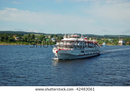 White river cruise boat with bank on a background