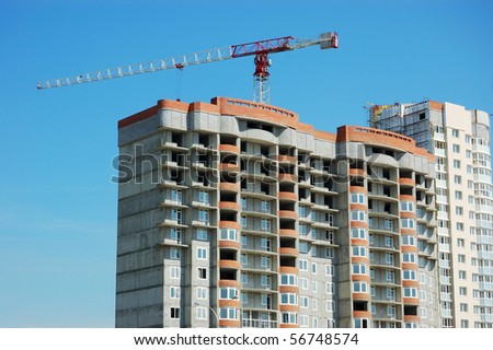 building under construction with lifting crane