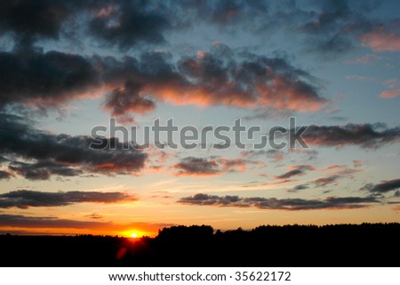evening sun falls for skyline beautiful  clouds