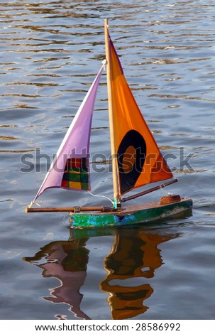 Small toy boat in water