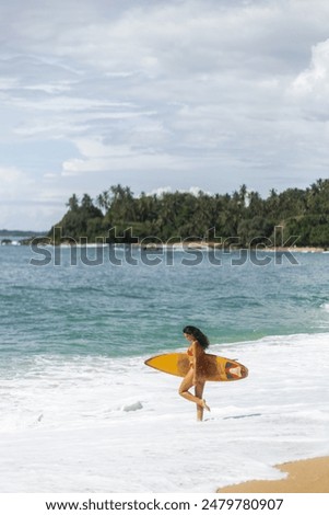 Similar – Image, Stock Photo Female surfer walking at the beach with surfboard