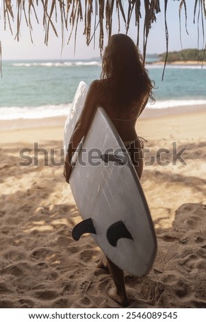 Similar – Image, Stock Photo Serene woman on surfboard in sea