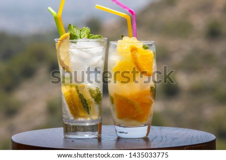 Summer bright drinks. Refreshing drinks and juices from citrus fruits with ice and min Imagine de stoc © 