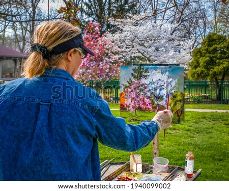 Similar – Image, Stock Photo Older woman painting on a notebook