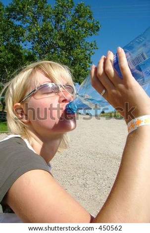 blond girl drinking from water-bottle