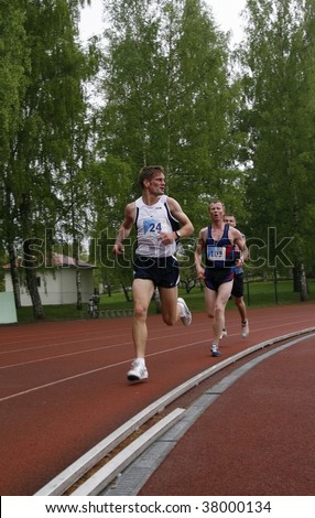 TARTU, ESTONIA - MAY 20: Athletes run along the track in Student Sell Games organized by  Estonian Academic Sports Federation May 20, 2006 in Tartu, Estonia.