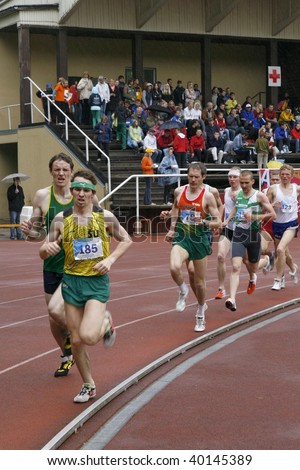 TARTU, ESTONIA - MAY 20: Athletes running along the track and taking part in Student Sell Games, organized by Estonian Academic Sports Federation on May 20, 2006 in Tartu, Estonia.