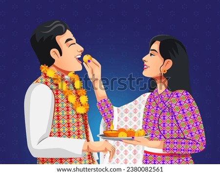 Nepalese women apply a seven colour Tika on forehead and putting laddu in brother's mouth on the occasion of Bhai Tihar or Bhai Tika wearing traditional ethnic clothes