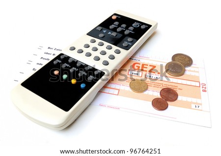 TV remote control and money coins on top of a invoice for radio and television license fees