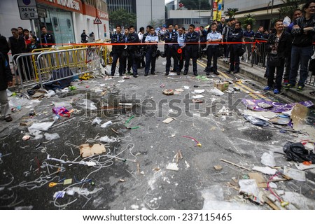 HONG KONG, DEC. 11. 2014: Workers and police remove barricades at an area blocked by pro-democracy protesters near the PLA headquarters, as today is the last day of the protest.