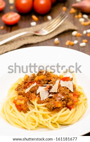 Spaghetti bolognese with minced meat sauce in vertical format