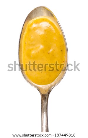 Spoon with spicy curry sauce in vertical format