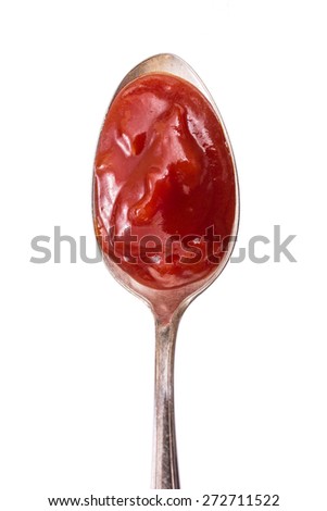 Cold hot chili pepper sauce on a spoon om vertical format