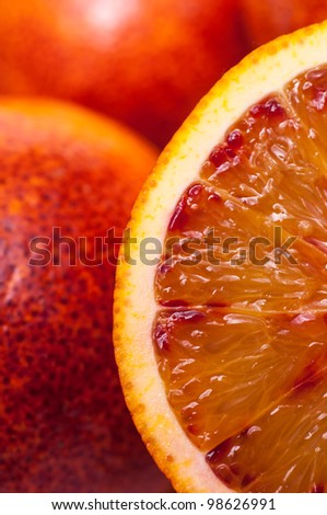 Close-up of a slice of a blood orange in vertical-format